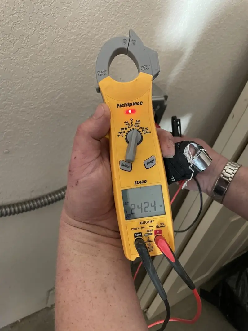 Voltage testing with clamp meter during Circuit Breaker Repair in Andover